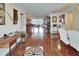 Open living area with hardwood floors, an elegant dining set, and a view of the water at 1710 New Bedford Dr, Sun City Center, FL 33573