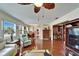 Living room featuring wood floors, large windows with water views and an open floor plan at 1710 New Bedford Dr, Sun City Center, FL 33573