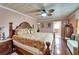 This main bedroom boasts hardwood floors, en-suite bathroom and a closet at 1710 New Bedford Dr, Sun City Center, FL 33573