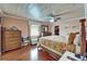 Spacious main bedroom features hardwood floors, closet and ensuite bathroom at 1710 New Bedford Dr, Sun City Center, FL 33573