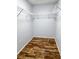 Walk-in closet with wire shelving and wood-look floors at 1848 Trillium Blvd, Brooksville, FL 34604