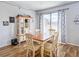 Cozy dining area with a wooden table, seating for four, and natural lighting at 1848 Trillium Blvd, Brooksville, FL 34604