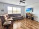 Inviting living room with a comfortable sectional sofa and wood-look flooring at 1848 Trillium Blvd, Brooksville, FL 34604