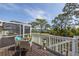 Outdoor deck overlooking lush lawn and water; ideal for morning coffee or evening relaxation at 2005 N Pointe Alexis Dr, Tarpon Springs, FL 34689