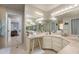 Bathroom boasts tile flooring, spacious vanity with extra lighting, and storage space at 2005 N Pointe Alexis Dr, Tarpon Springs, FL 34689