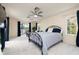 Spacious bedroom features soft carpet, view of deck, and comfortable sleeping arrangements at 2005 N Pointe Alexis Dr, Tarpon Springs, FL 34689