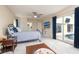 Bedroom with a sliding glass door to the pool, ceiling fan, and neutral decor at 2005 N Pointe Alexis Dr, Tarpon Springs, FL 34689