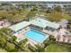 Aerial view of community clubhouse and sparkling pool and tennis courts. Time to relax and enjoy! at 2005 N Pointe Alexis Dr, Tarpon Springs, FL 34689