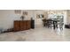 Open dining area with tile flooring, pendant lighting, and an adjacent outdoor view at 2005 N Pointe Alexis Dr, Tarpon Springs, FL 34689