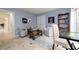 Bright game room boasts comfortable seating, game-themed decor, and stylish accents at 2005 N Pointe Alexis Dr, Tarpon Springs, FL 34689