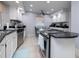 Bright kitchen features stainless steel appliances, white cabinetry, and a central island at 2005 N Pointe Alexis Dr, Tarpon Springs, FL 34689