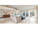 Open living area features natural light, tile floors and access to outdoor space at 2005 N Pointe Alexis Dr, Tarpon Springs, FL 34689