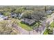 Aerial view of a charming home nestled among mature trees and a quaint neighborhood street at 217 2Nd Sw St, Largo, FL 33770