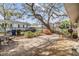 Inviting backyard with brick patio, mature trees, and fenced perimeter at 217 2Nd Sw St, Largo, FL 33770
