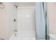 Bright bathroom featuring a tiled shower with a tub and shower curtain at 217 2Nd Sw St, Largo, FL 33770