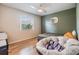 Cozy bedroom featuring natural light, hardwood floors, and a plush dog bed at 217 2Nd Sw St, Largo, FL 33770