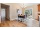 Cozy dining area adjacent to the kitchen with stylish furnishings and natural light from the sliding doors at 217 2Nd Sw St, Largo, FL 33770
