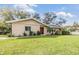 Charming single-story home featuring a well-manicured lawn and beautiful landscaping at 217 2Nd Sw St, Largo, FL 33770