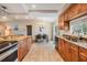 Open kitchen featuring granite countertops, stainless steel appliances, and an adjacent dining area at 217 2Nd Sw St, Largo, FL 33770