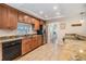 Bright kitchen featuring wood cabinets, granite countertops, and stainless steel appliances at 217 2Nd Sw St, Largo, FL 33770