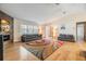 Bright and airy living room with vaulted ceilings, stylish furnishings, and a contemporary fireplace at 217 2Nd Sw St, Largo, FL 33770
