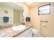 Bathroom featuring a vanity, walk-in shower, clock, and towel rack at 226 Woodlake Wynde, Oldsmar, FL 34677