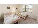 Bright bedroom features two twin beds, neutral carpeting, and a window overlooking the community at 226 Woodlake Wynde, Oldsmar, FL 34677