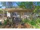 Inviting front porch with plants and a decorative wreath on the front door at 3008 Dodge St, Tampa, FL 33605