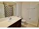 Bathroom with a modern vanity, white countertop, and tile flooring at 3032 Inlet Breeze Way, Holiday, FL 34691