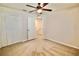 Carpeted bedroom with ceiling fan and a closet at 3032 Inlet Breeze Way, Holiday, FL 34691