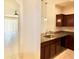 Open kitchen with granite countertops, stainless steel sink, and ample natural light at 3032 Inlet Breeze Way, Holiday, FL 34691