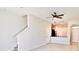 Open-concept living area featuring tile floors, a ceiling fan, and view of the kitchen at 3032 Inlet Breeze Way, Holiday, FL 34691