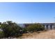 View of a wooden pier extending into the water under a clear blue sky at 3032 Inlet Breeze Way, Holiday, FL 34691