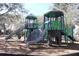 Outdoor playground featuring slides, climbing walls and shaded tree house structures for recreational enjoyment at 3032 Inlet Breeze Way, Holiday, FL 34691