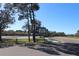 Community recreation center sign with green lawn and mature trees at 3032 Inlet Breeze Way, Holiday, FL 34691