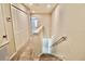 Carpeted stairs lead down; a closet is on the upper level at 3032 Inlet Breeze Way, Holiday, FL 34691