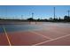 Community tennis courts featuring a colorful painted surface and net, perfect for friendly matches at 3032 Inlet Breeze Way, Holiday, FL 34691