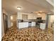 Bright kitchen featuring stainless steel appliances and unique patterned flooring at 3136 Primrose Dr, Holiday, FL 34691