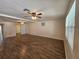 Bright living room featuring wood-style floors, ceiling fan and great light at 3136 Primrose Dr, Holiday, FL 34691