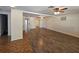 Open-concept living room with tile and wood-look floors and plenty of natural light at 3136 Primrose Dr, Holiday, FL 34691