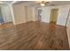 Spacious living room with wood-look floors, bright natural light, and neutral paint at 3136 Primrose Dr, Holiday, FL 34691