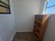 Versatile storage area with a built-in shelving unit and a window at 3136 Primrose Dr, Holiday, FL 34691