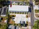 Overhead shot of a commercial building with a parking lot, street access, and small landscaped courtyards at each unit at 3402 E 28Th Ave # 7, Tampa, FL 33605