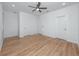 Spacious bedroom with wood floors, ceiling fan, and multiple closets at 3402 E 28Th Ave # 7, Tampa, FL 33605