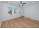 Light-filled bedroom with recessed lighting, multiple windows, and wood flooring at 3402 E 28Th Ave # 7, Tampa, FL 33605