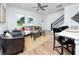 Inviting living room with hardwood floors, natural light, and modern decor, blending seamlessly with the kitchen at 3402 E 28Th Ave # 7, Tampa, FL 33605
