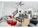 Comfortable living area with modern furnishings, a ceiling fan, and an open floor plan leading to the kitchen at 3402 E 28Th Ave # 7, Tampa, FL 33605
