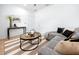 Bright living room featuring modern decor, comfortable sofa, decorative area rug, and stylish accents at 3402 E 28Th Ave # 7, Tampa, FL 33605