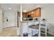 Cozy kitchen with breakfast bar, stainless steel appliances, and granite countertops at 36750 Us Highway 19 N # 01205, Palm Harbor, FL 34684