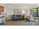 Cozy living room area with seating, a dining table and kitchenette with breakfast bar at 36750 Us Highway 19 N # 01205, Palm Harbor, FL 34684